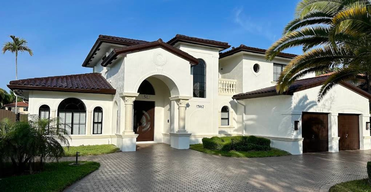 Exterior house painting with premium white finish by Brito Unlimited Painting in South Florida